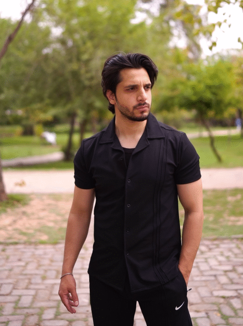Polo shirt with baggy trousers.